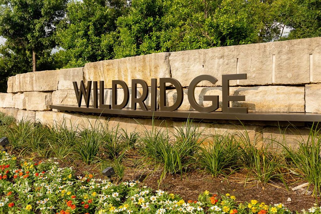 8715 Wildberry Road Oak Point, TX 75068 - Photo 16 of 23 a street sign that is next to a road
