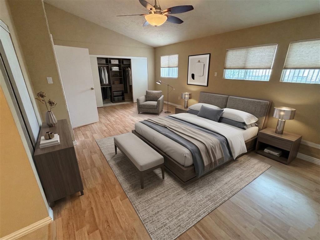 2051 Embassy Way Carrollton, TX 75006 - Photo 12 of 20 Bedroom featuring light wood finished floors, vaulted ceiling, a ceiling fan, and a closet