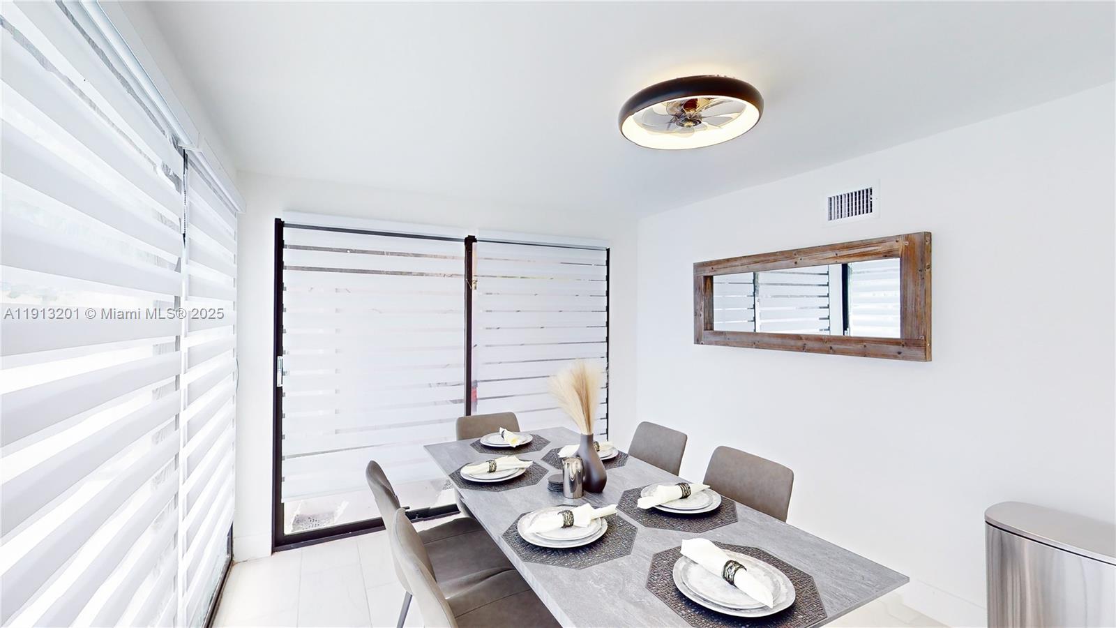 6630 Cody Street Hollywood, FL 33024 - Photo 21 of 45 a dining room with furniture and window