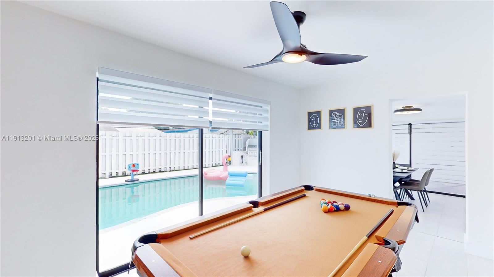 6630 Cody Street Hollywood, FL 33024 - Photo 27 of 45 a room with pool table and a ceiling fan