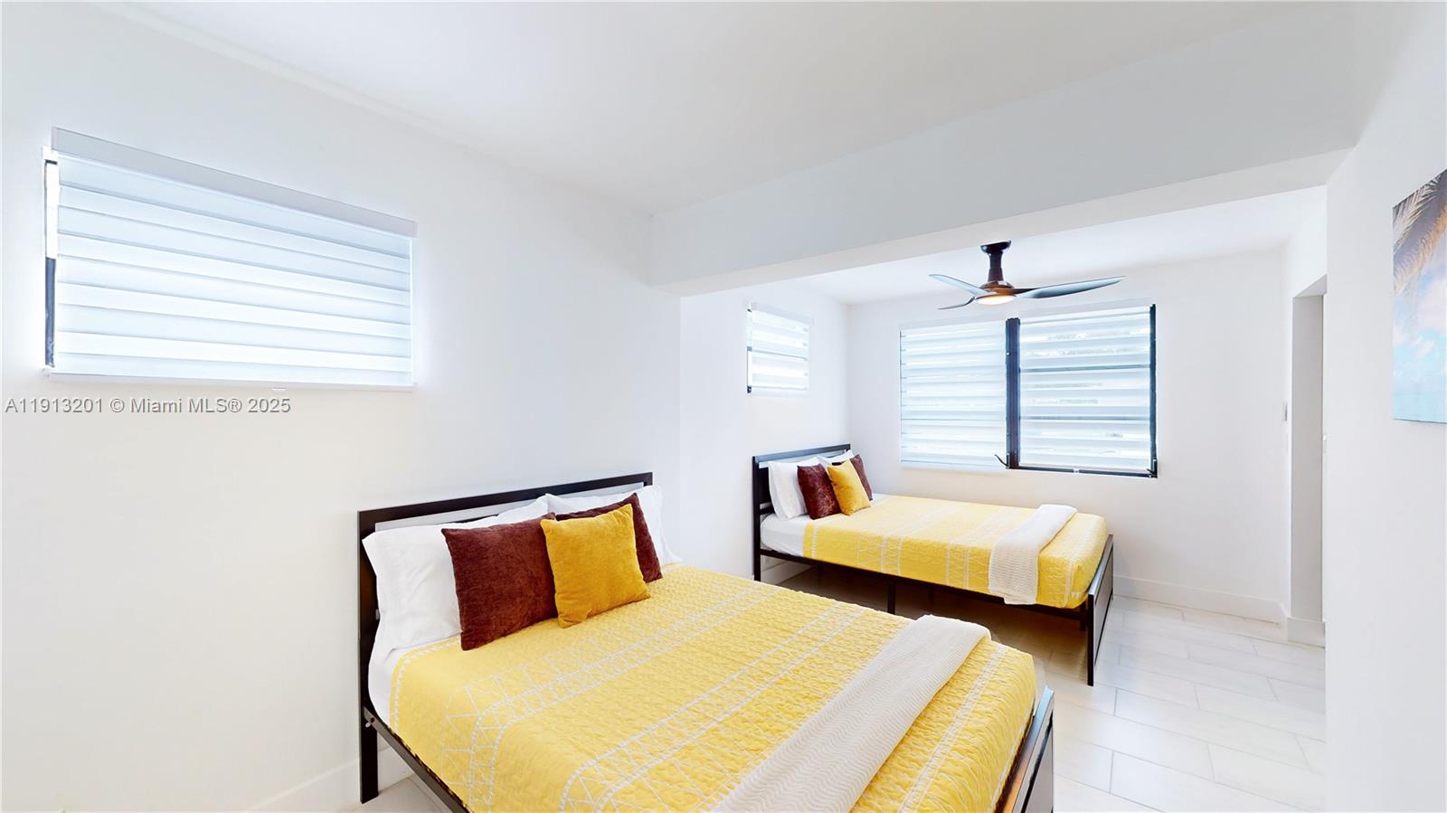 6630 Cody Street Hollywood, FL 33024 - Photo 28 of 45 a bedroom with two beds and a window