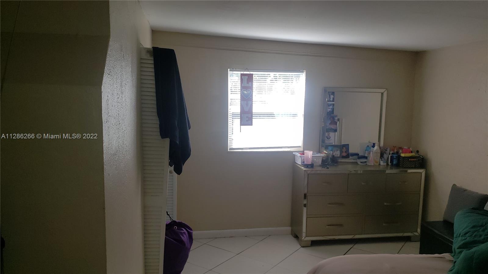 559 Dogwood Road West Palm Beach, FL 33409 - Photo 4 of 7 a room with window and cabinet