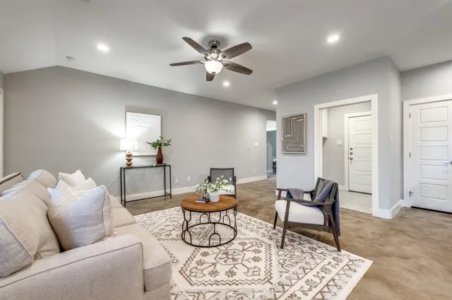 a living room with furniture and a rug