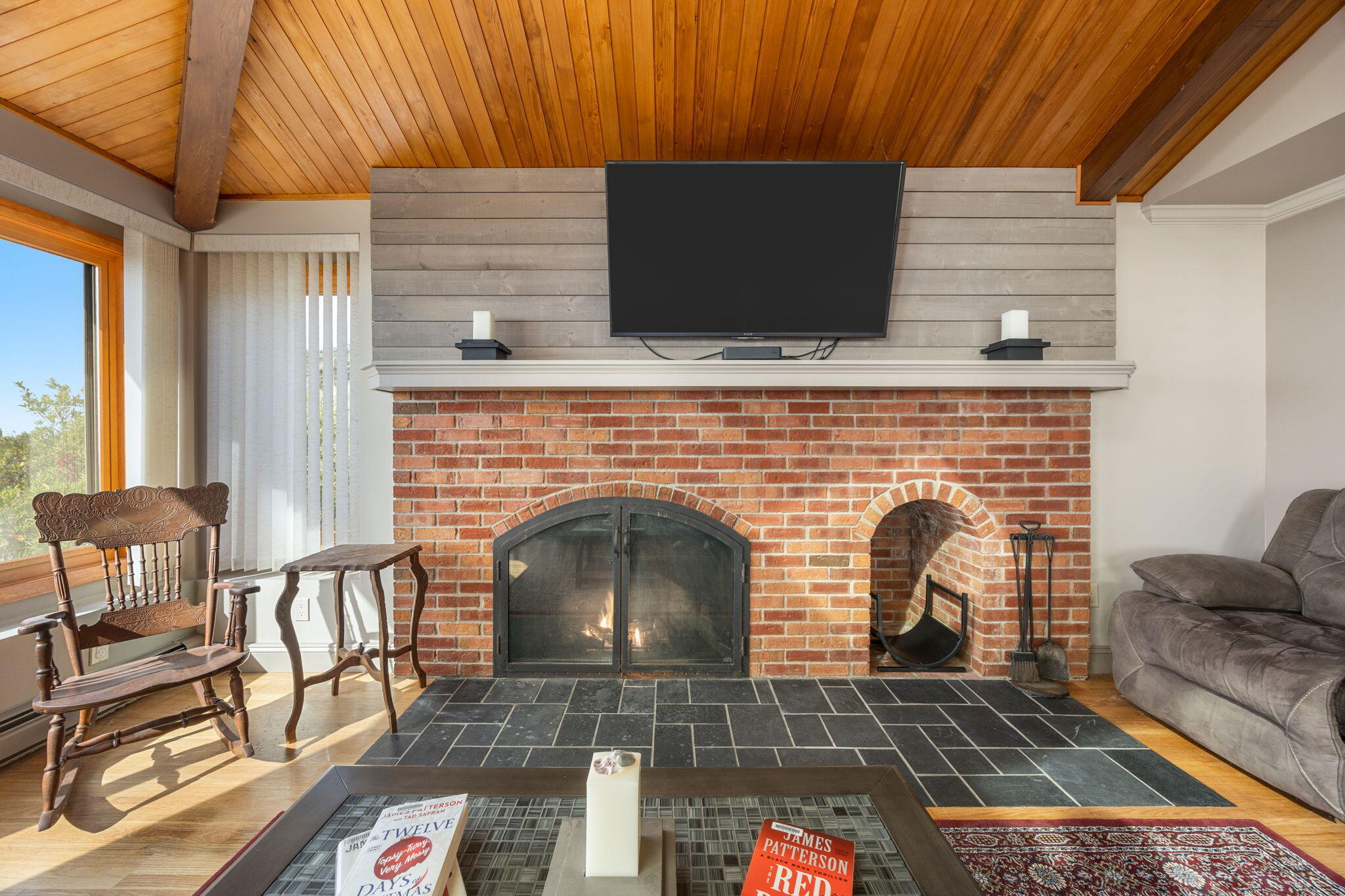 52 Corn Hill Road Truro, MA 02666 - Photo 21 of 74 a living room with furniture and a fireplace