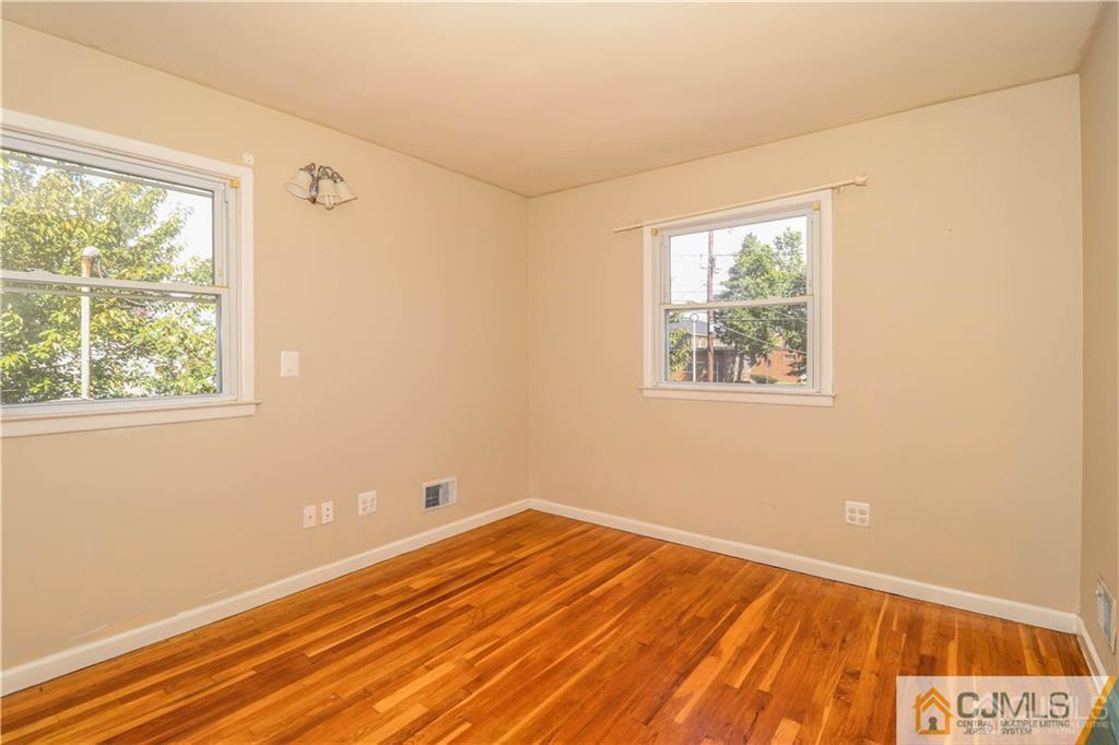 170 Vineyard Road Edison, NJ 08817 - Photo 15 of 20 a view of a room with wooden floor and windows
