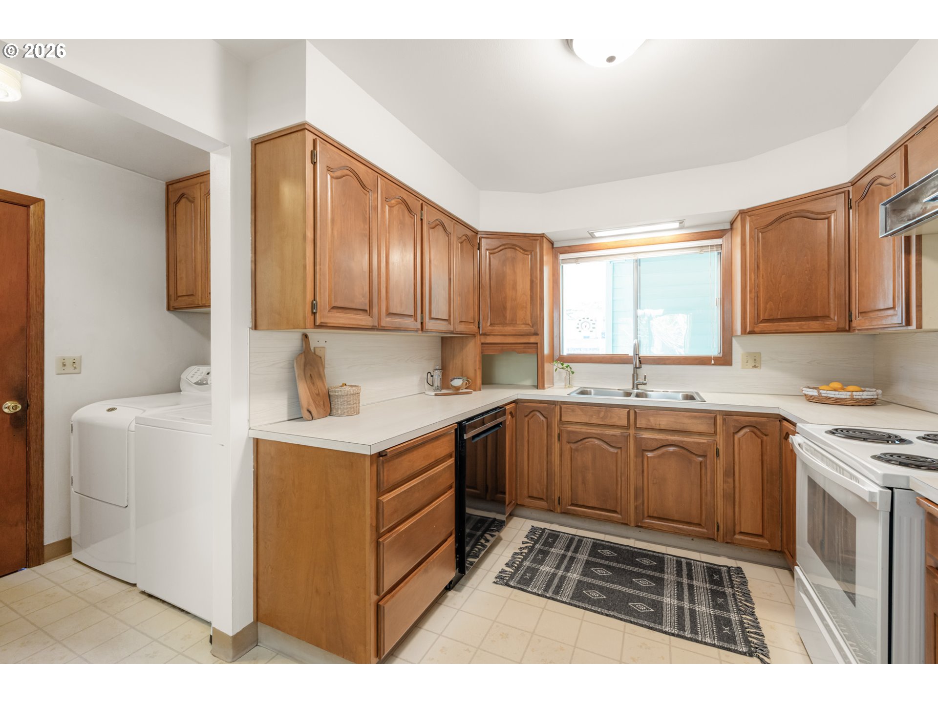 9025 Southwest Avery Street Tualatin, OR 97062 - Photo 13 of 35 a kitchen with a cabinets and sink