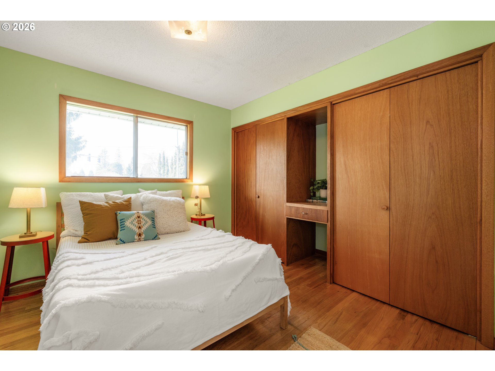 9025 Southwest Avery Street Tualatin, OR 97062 - Photo 17 of 35 a bedroom with a bed and a window