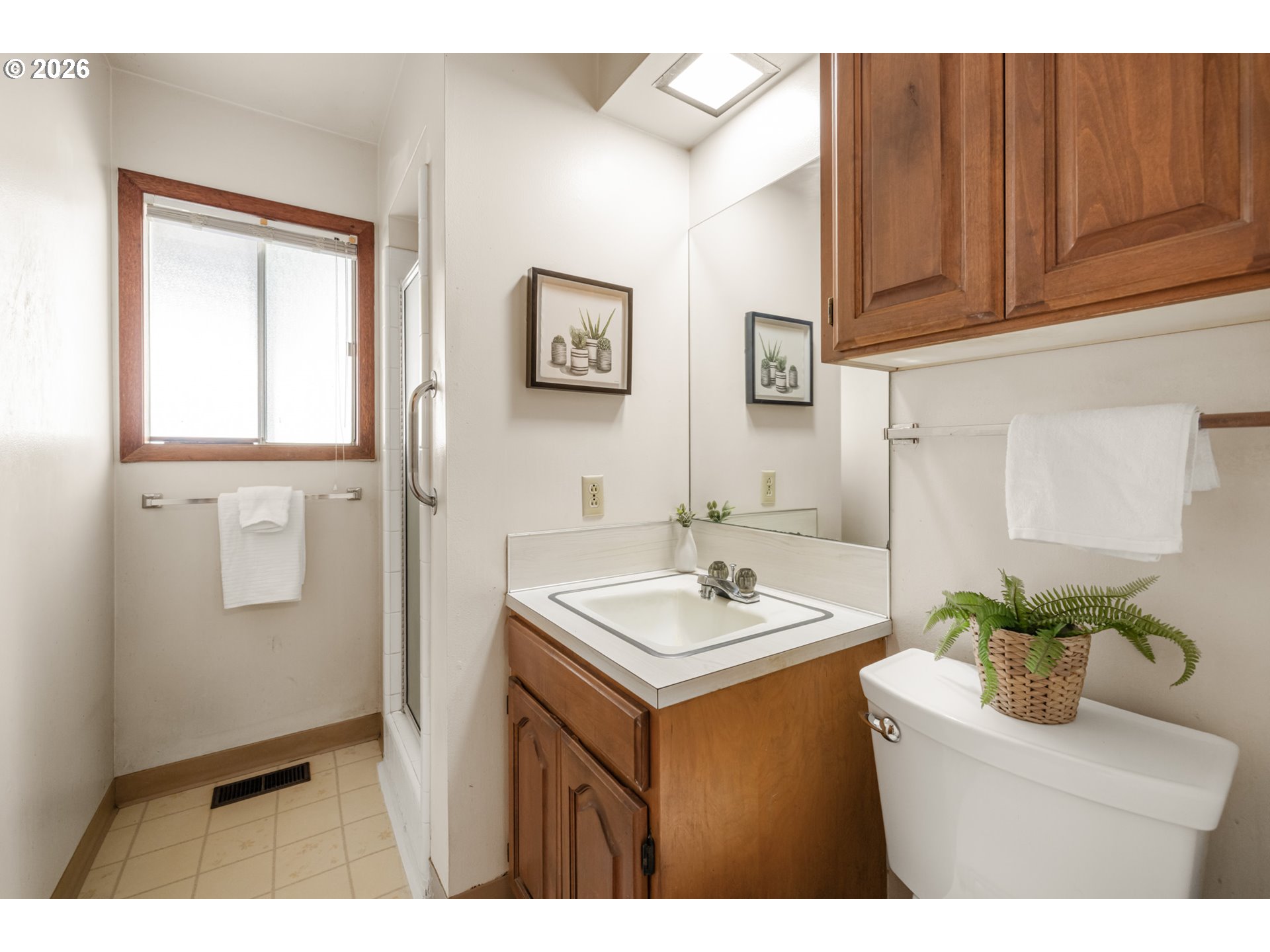 9025 Southwest Avery Street Tualatin, OR 97062 - Photo 22 of 35 a bathroom with a sink a mirror and a toilet