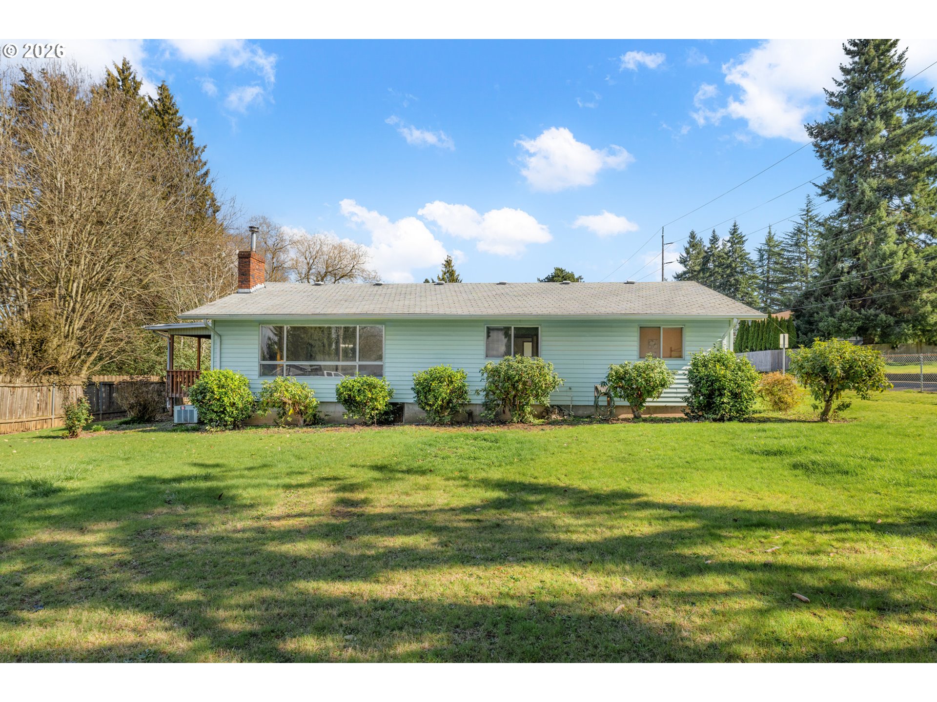 9025 Southwest Avery Street Tualatin, OR 97062 - Photo 35 of 35 a front view of a house with a garden