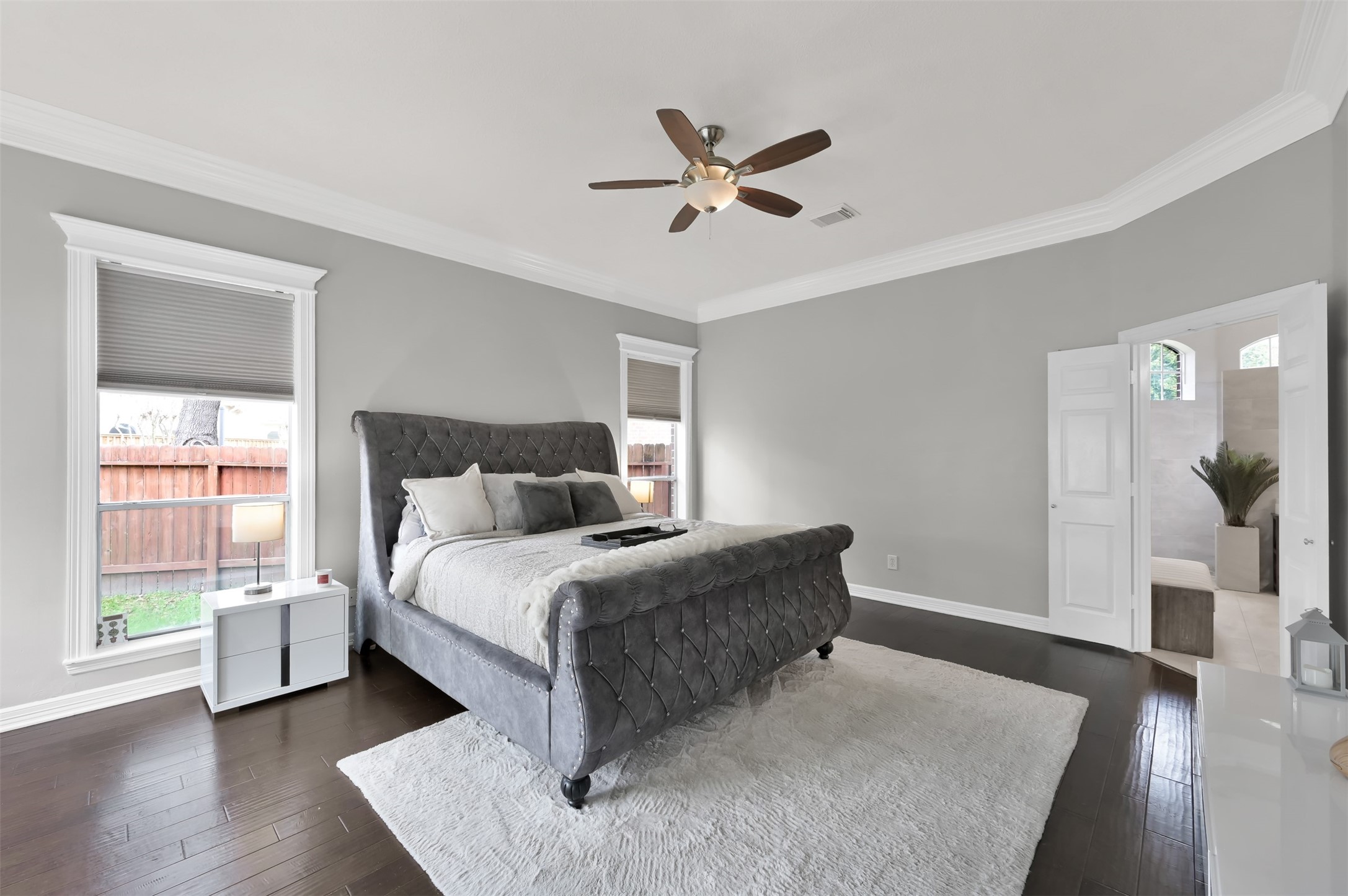 9706 Chipstead Court Spring, TX 77379 - Photo 23 of 44 Now let's go past the dining room and your staircase to get to your HUGE primary bedroom.