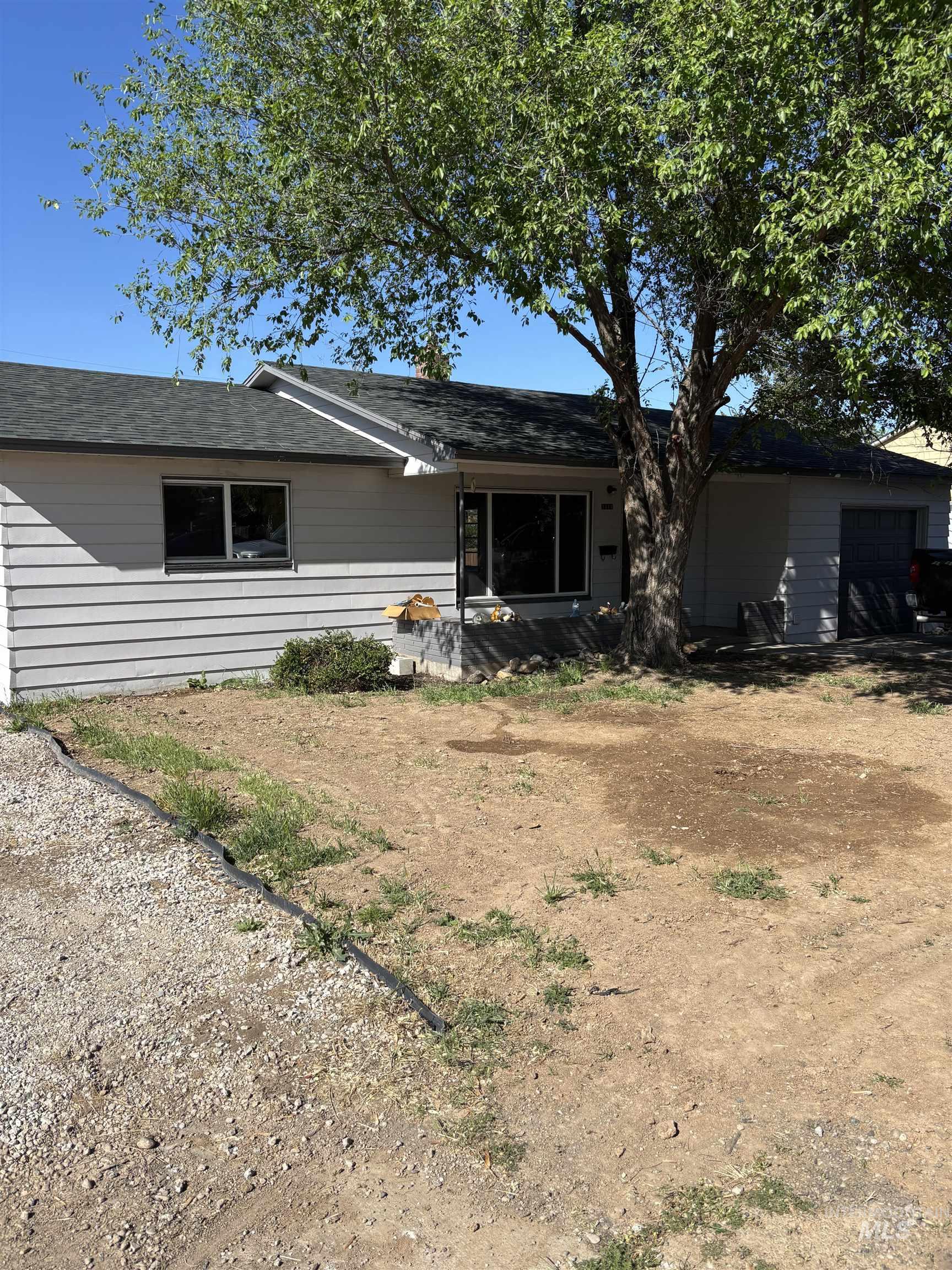 5116 West Morris Hill Road Boise, ID 83706 - Photo 17 of 19 Ranch-style residence featuring light gray siding and a dark shingle roof