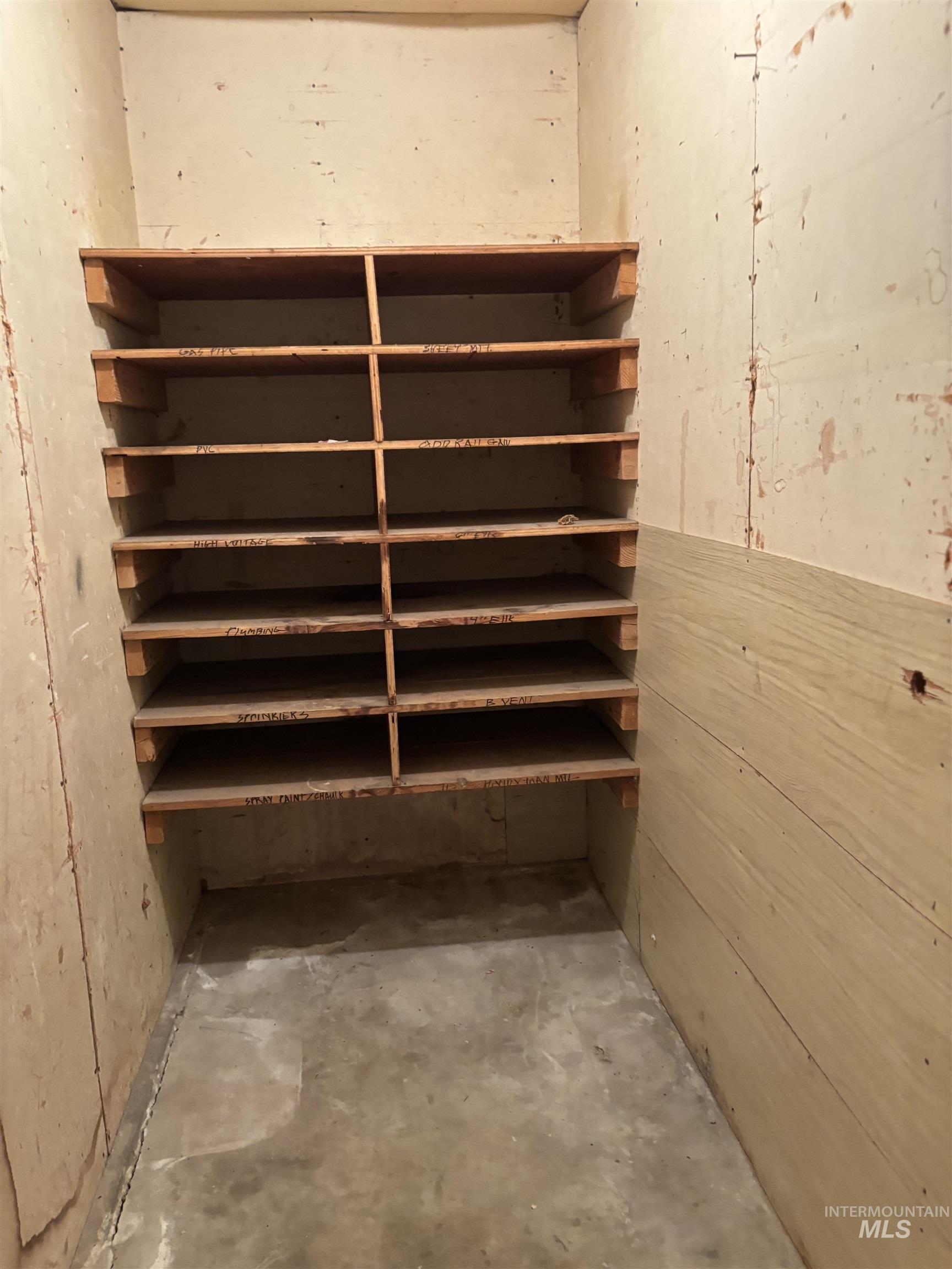 5116 West Morris Hill Road Boise, ID 83706 - Photo 18 of 19 Built-in wooden shelving system offering multi-level storage