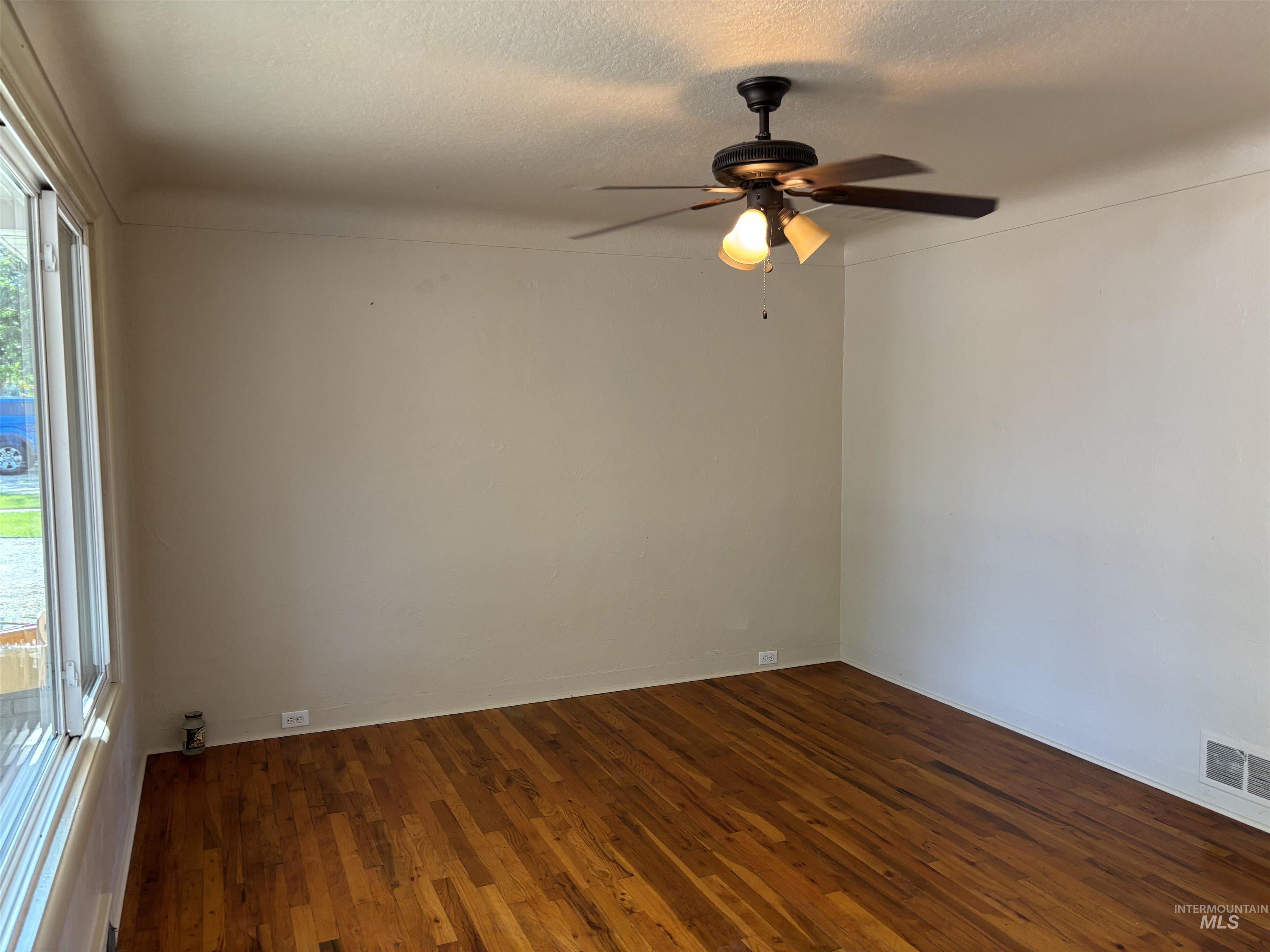 5116 West Morris Hill Road Boise, ID 83706 - Photo 3 of 19 Hardwood flooring extending throughout the space