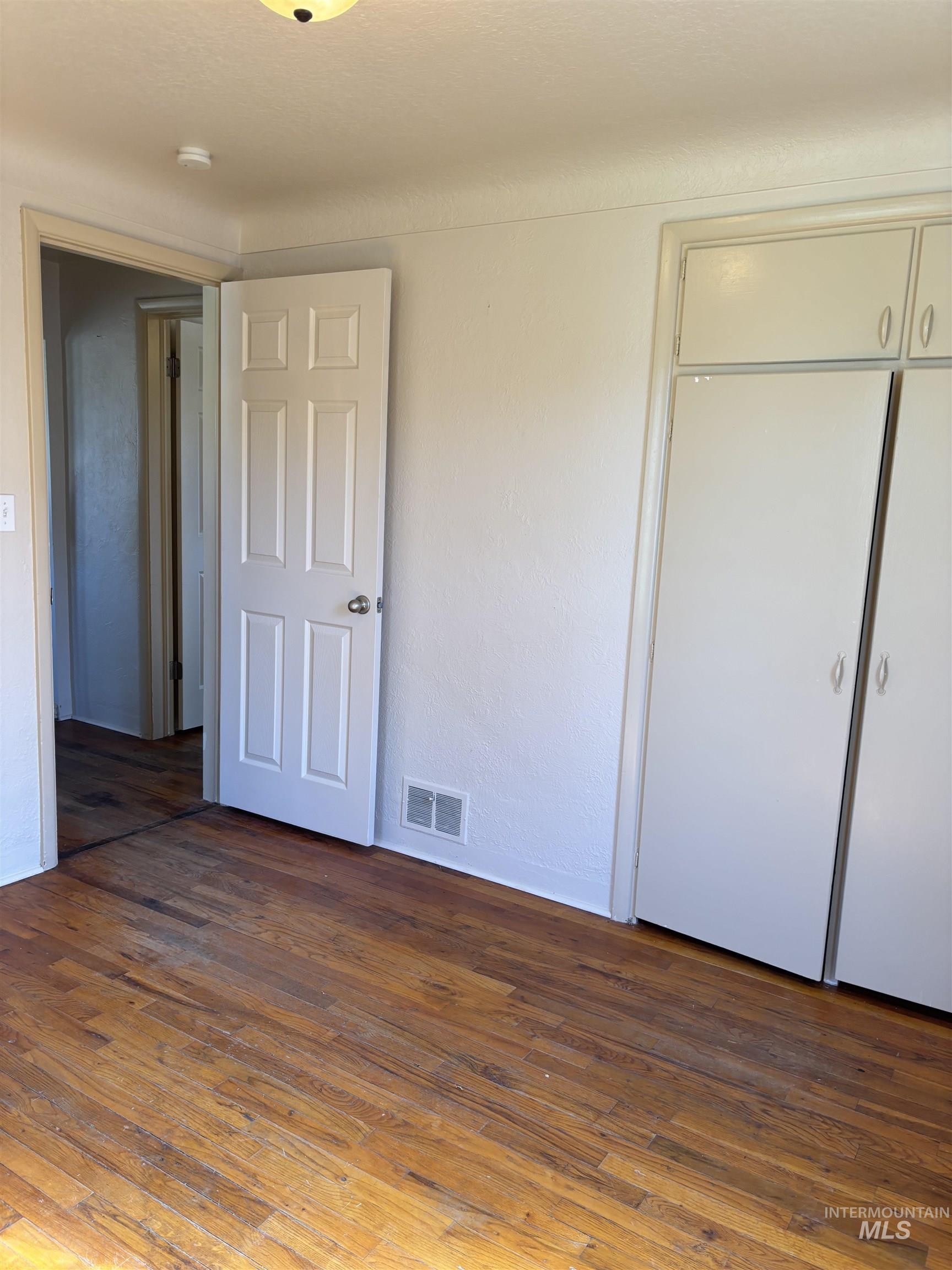 5116 West Morris Hill Road Boise, ID 83706 - Photo 9 of 19 Hardwood flooring extending throughout the room