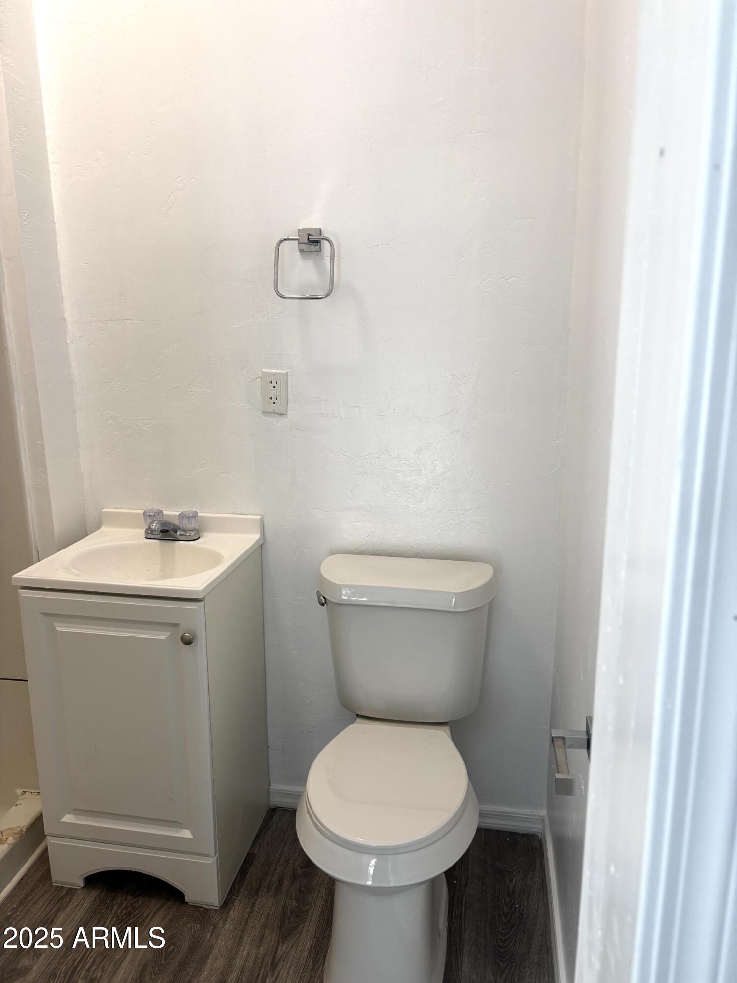 633 East 9th Street, Unit 14 Douglas, AZ 85607 - Photo 5 of 7 a white toilet sitting next to a white sink and vanity