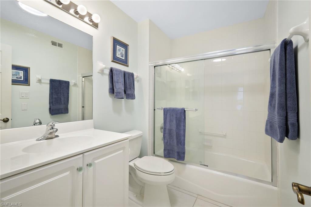 286 4th Street South, Unit 203 Naples, FL 34102 - Photo 18 of 25 a bathroom with a sink toilet and shower