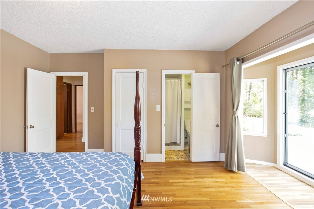 16919 112th Place Northeast Bothell, WA 98011 - Photo 15 of 40 a bedroom with a bed and a window