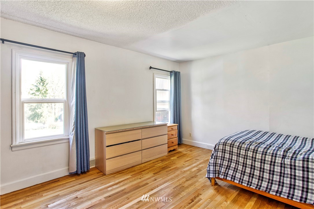 16919 112th Place Northeast Bothell, WA 98011 - Photo 16 of 40 a bedroom with a bed and a window