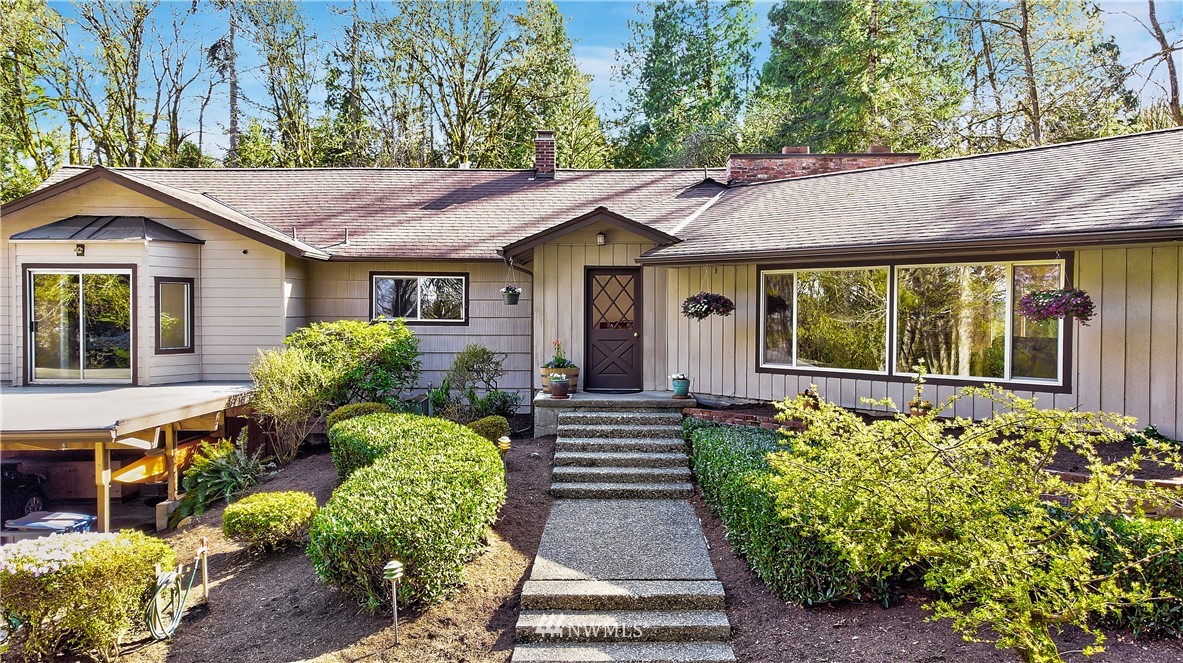 16919 112th Place Northeast Bothell, WA 98011 - Photo 3 of 40 a front view of a house with garden