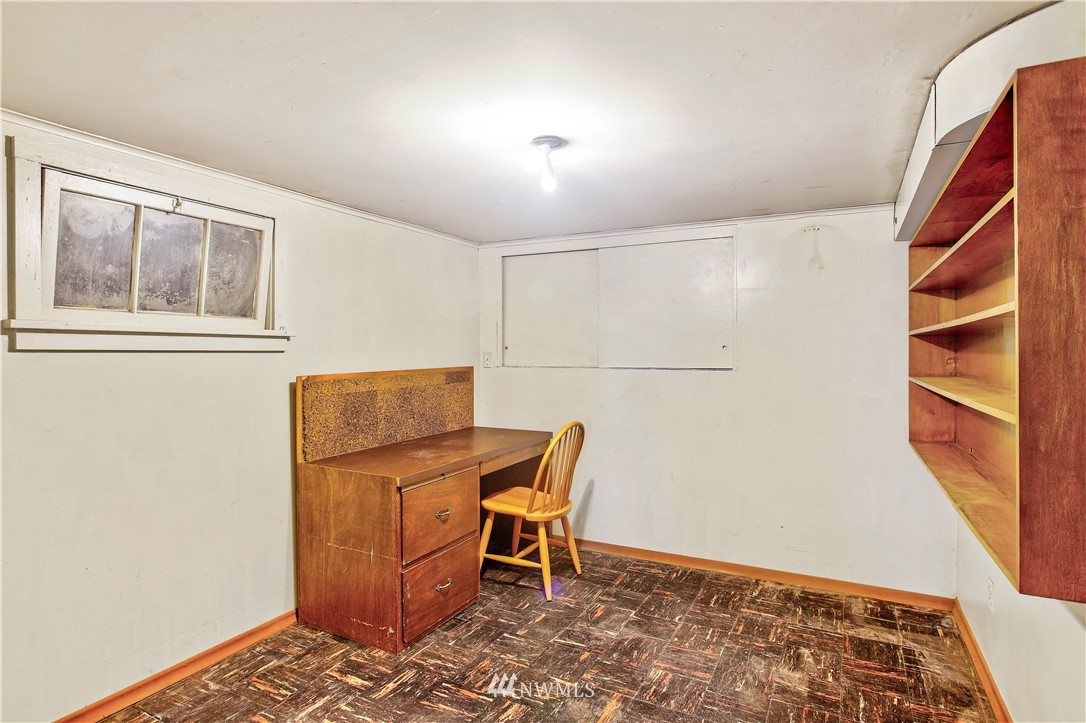 16919 112th Place Northeast Bothell, WA 98011 - Photo 21 of 40 a living room with a chair and a table