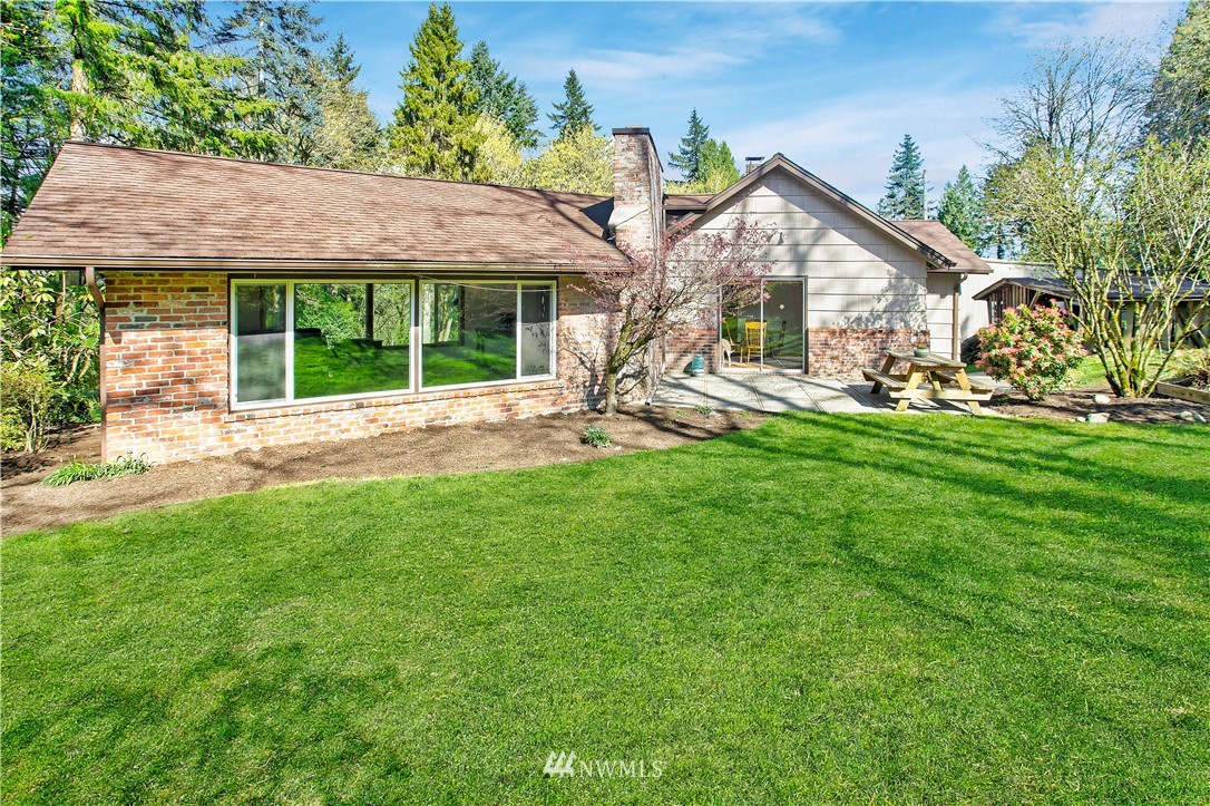 16919 112th Place Northeast Bothell, WA 98011 - Photo 25 of 40 a view of a house with a yard and sitting area