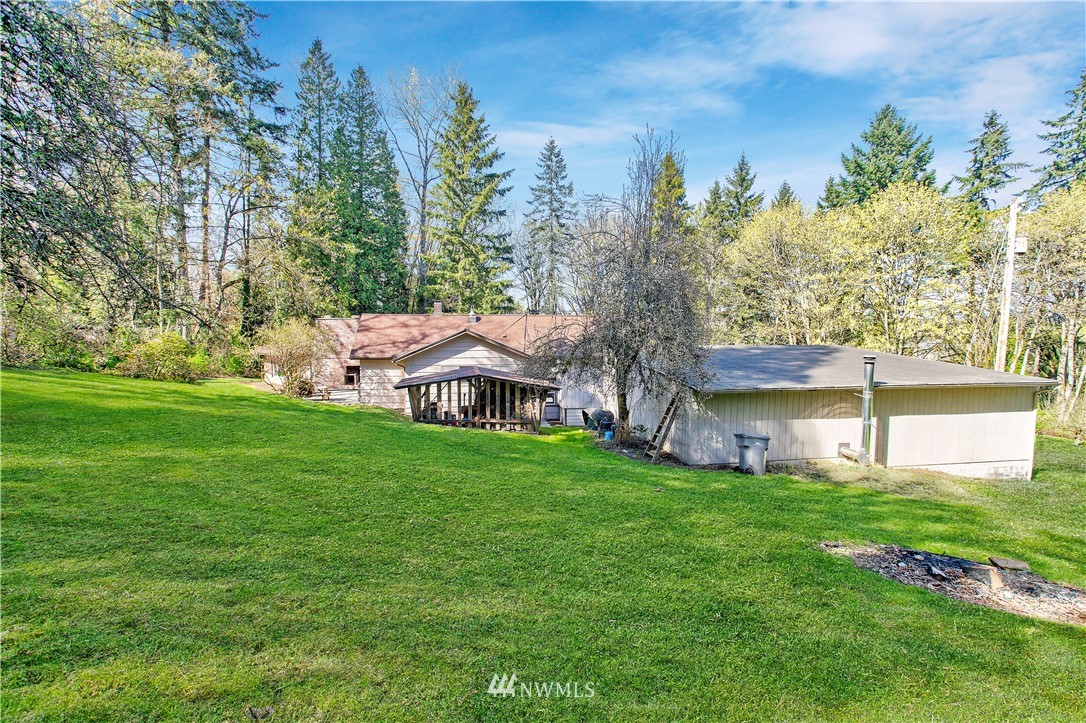 16919 112th Place Northeast Bothell, WA 98011 - Photo 26 of 40 a view of a house with a yard and sitting area