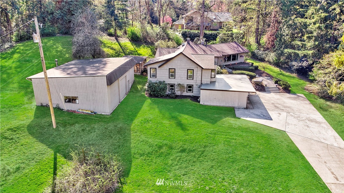 16919 112th Place Northeast Bothell, WA 98011 - Photo 27 of 40 a aerial view of a house with a big yard plants and large trees