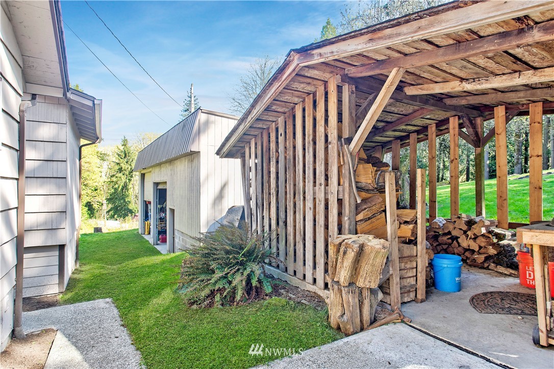 16919 112th Place Northeast Bothell, WA 98011 - Photo 30 of 40 a patio with table and chairs and potted plants