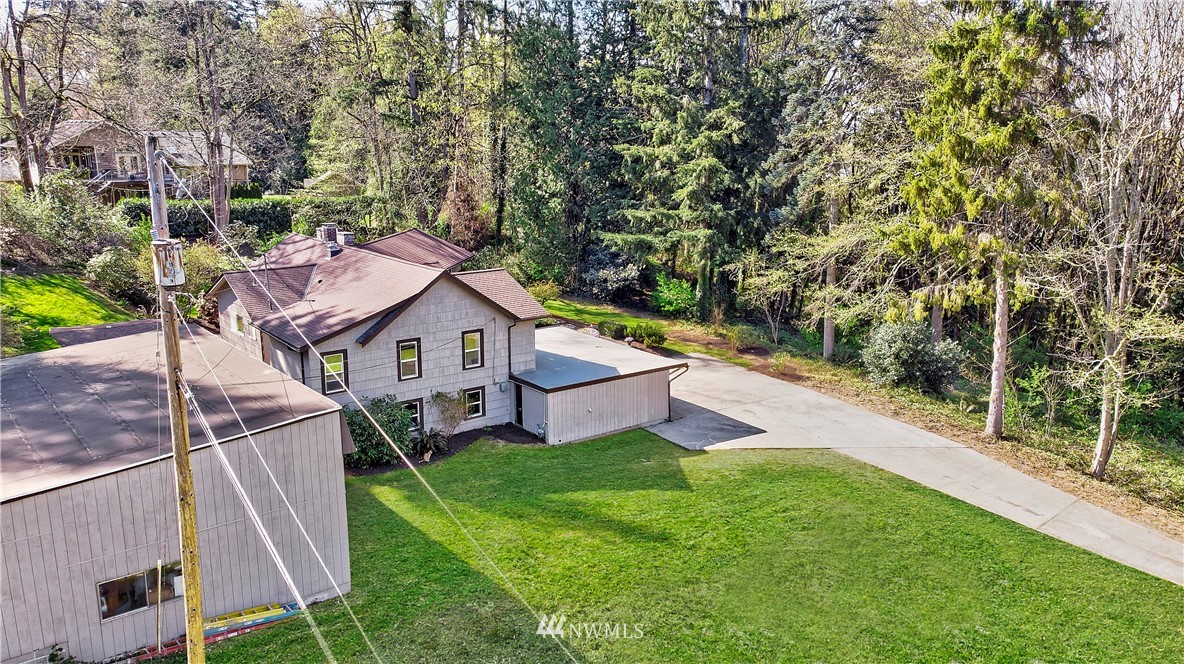 16919 112th Place Northeast Bothell, WA 98011 - Photo 37 of 40 a aerial view of a house with a yard table and chairs