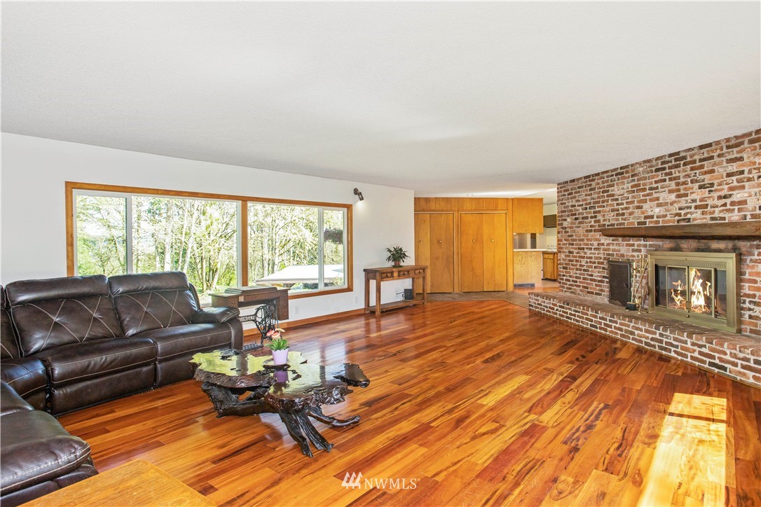 16919 112th Place Northeast Bothell, WA 98011 - Photo 5 of 40 a living room with furniture and a fireplace