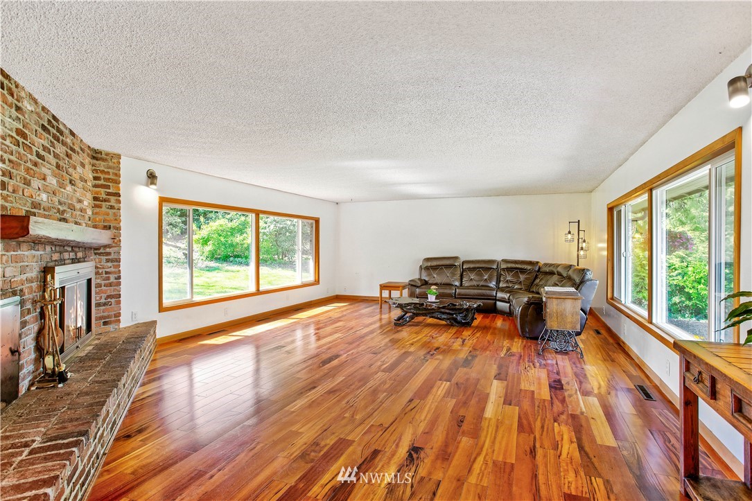 16919 112th Place Northeast Bothell, WA 98011 - Photo 6 of 40 a living room with furniture stove and a wooden floor