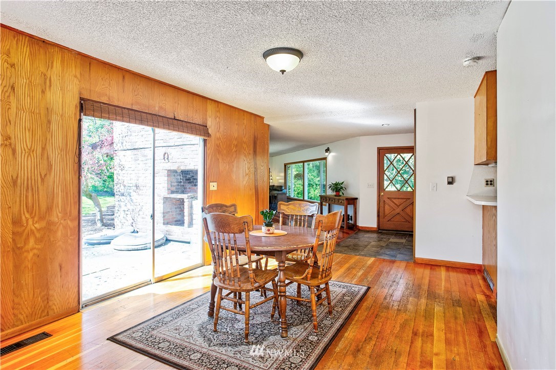 16919 112th Place Northeast Bothell, WA 98011 - Photo 9 of 40 a dining room with furniture and wooden floor