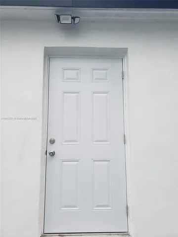 a bathroom with a shower and a glass door