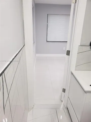 an aerial view of a house with a yard and garden