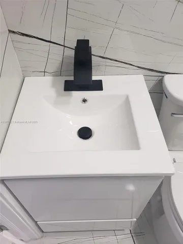 an aerial view of a house with yard swimming pool and outdoor seating