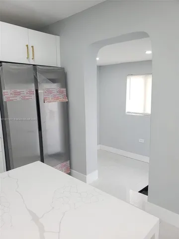 a bathroom with a shower and a tub