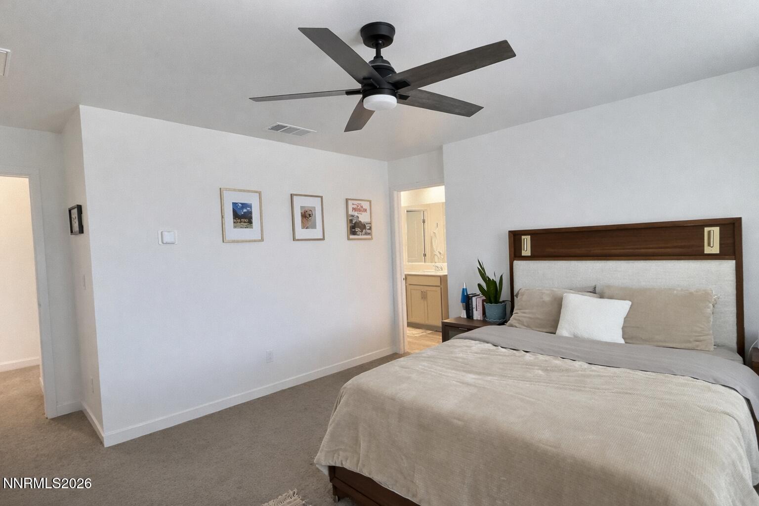 641 Pleasant Vista Drive Reno, NV 89506 - Photo 17 of 30 a bedroom with a bed and a ceiling fan