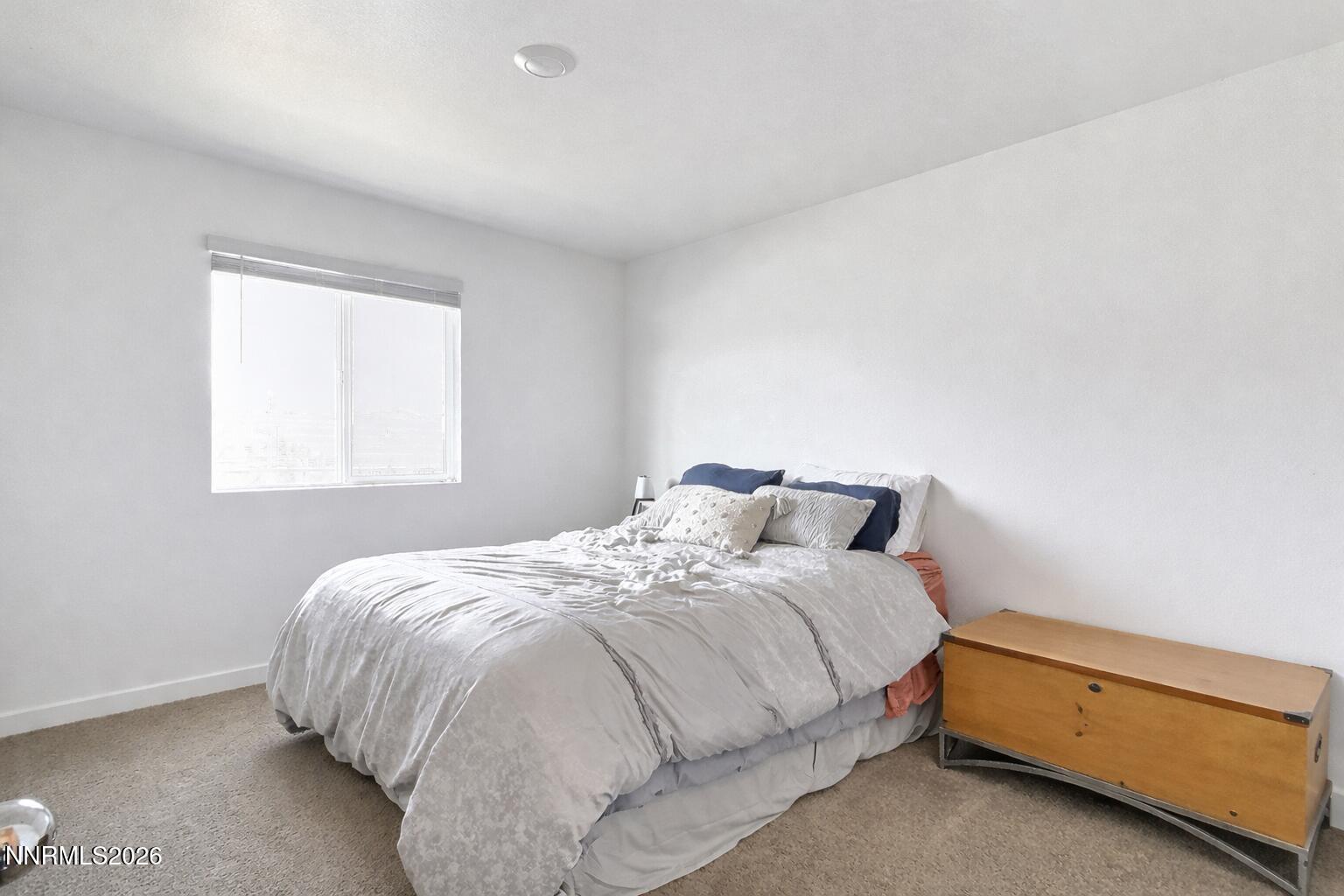 641 Pleasant Vista Drive Reno, NV 89506 - Photo 24 of 30 a bedroom with a bed and window