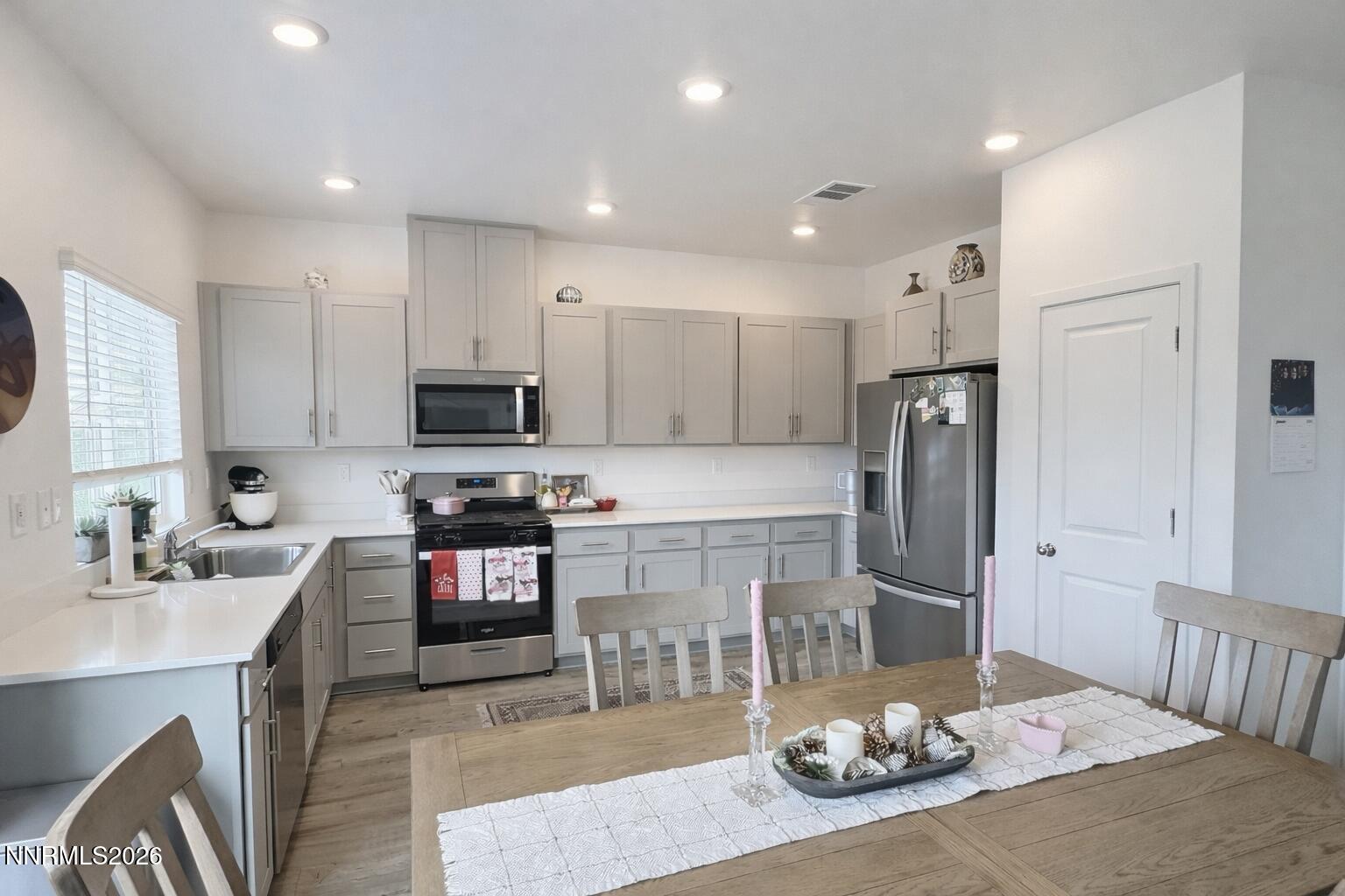 641 Pleasant Vista Drive Reno, NV 89506 - Photo 10 of 30 a kitchen with stainless steel appliances granite countertop a sink refrigerator and cabinets