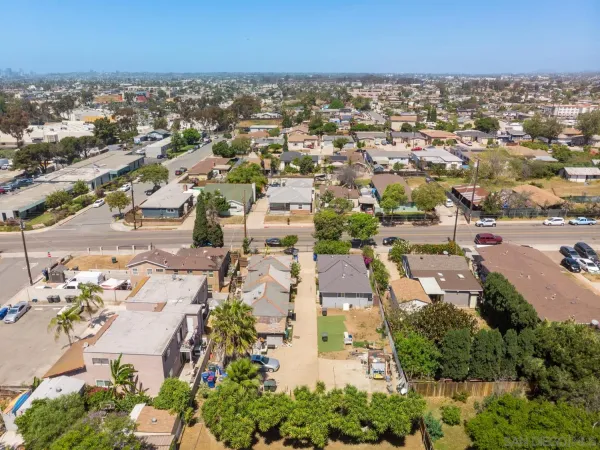 an aerial view of residential building with parking