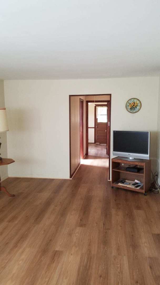 426 South Adeline Avenue Addison, IL 60101 - Photo 3 of 13 a view of livingroom with furniture and flat screen tv