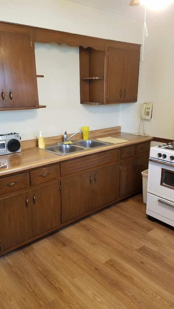 426 South Adeline Avenue Addison, IL 60101 - Photo 5 of 13 a kitchen with stainless steel appliances granite countertop a sink and a stove