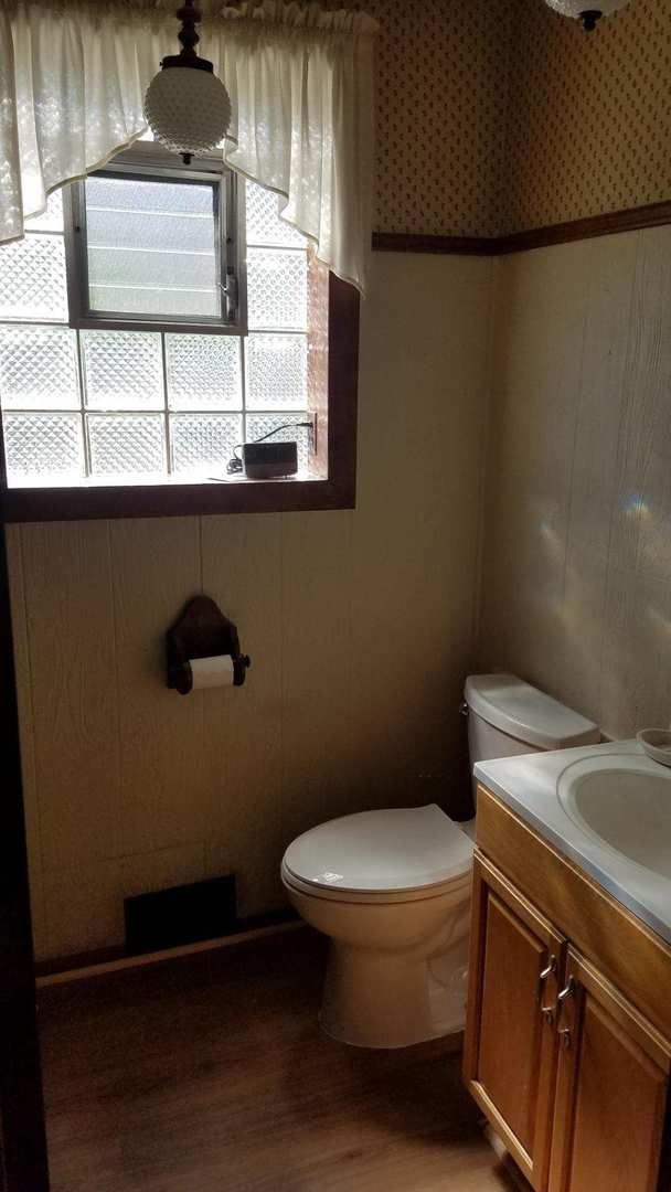 426 South Adeline Avenue Addison, IL 60101 - Photo 8 of 13 a bathroom with a toilet and a sink