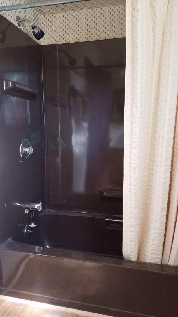 426 South Adeline Avenue Addison, IL 60101 - Photo 9 of 13 a bathroom with a mirror