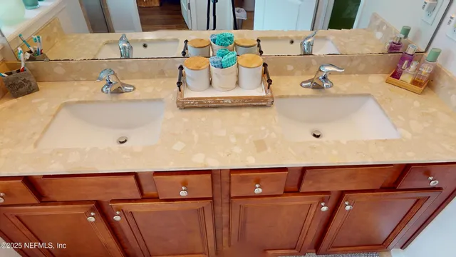 a bathroom with a sink and a large mirror