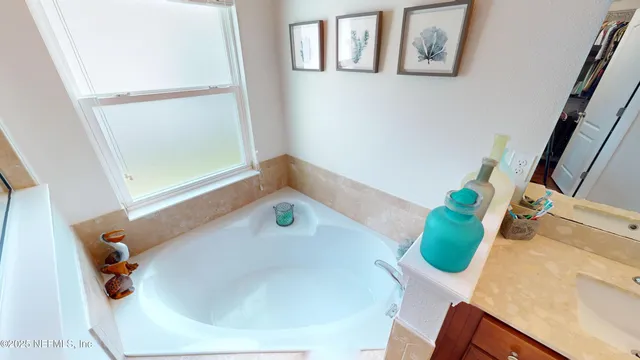 a bathroom with a sink and mirror