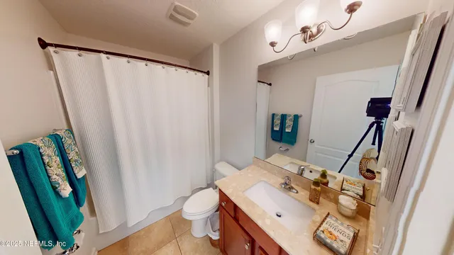 a bathroom with a sink a mirror and a toilet