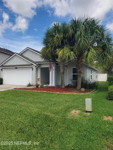front view of a house with a garden