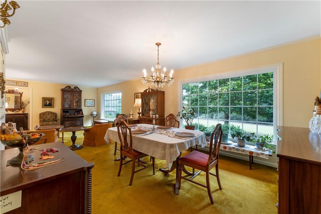 79 Floyd Road Southwest Cartersville, GA 30120 - Photo 11 of 50 a view of a dining room with furniture window and outside view