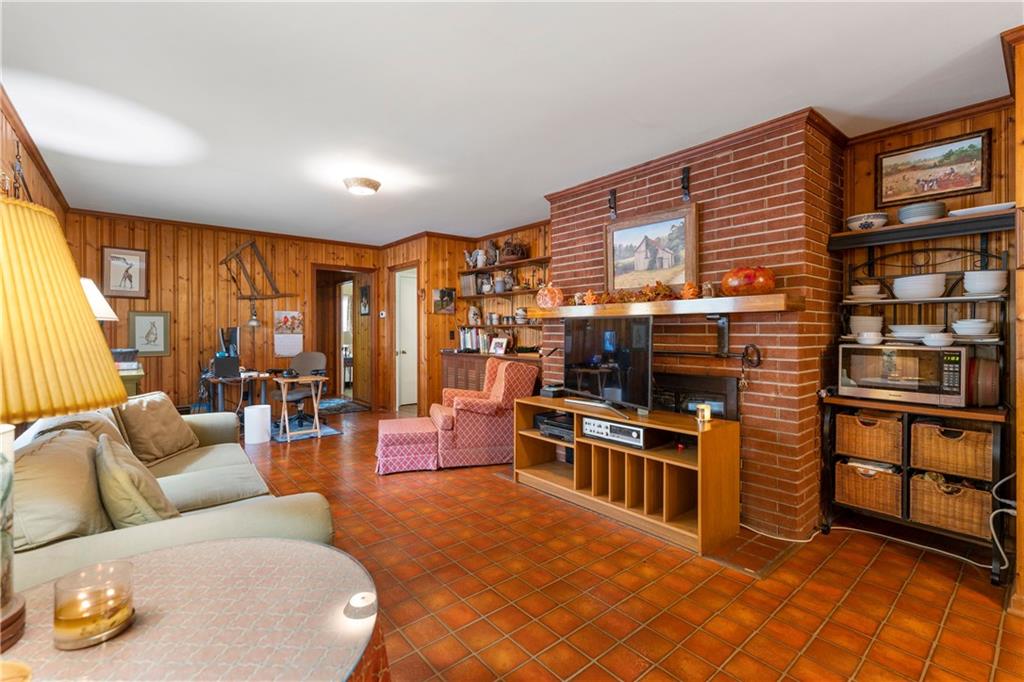79 Floyd Road Southwest Cartersville, GA 30120 - Photo 18 of 50 a living room with furniture a flat screen tv and floor to ceiling window